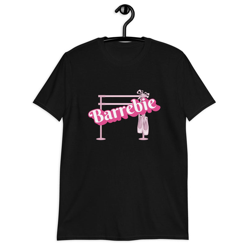 Adult woman's t-shirt for fans of the Barbie movie, ballet, and ballet barre. Black shirt with a Barbie pink design showing a ballet barre and pointe shoes.