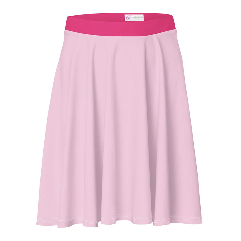 A pastel pink women's skater skirt with a bright pink, stretchy waistband and a dancewear logo. 